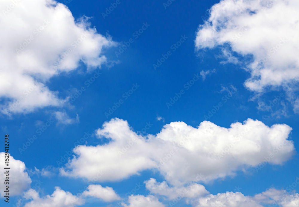 Naklejka premium White clouds scattered in the clear blue sky. Sky and clouds landscape. Sky background