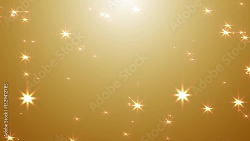 Abstract glowing particles stardust sparkling light on golden, yellow background.