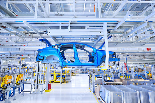 Blue car body frame at a modern automobile assembly line factory production process