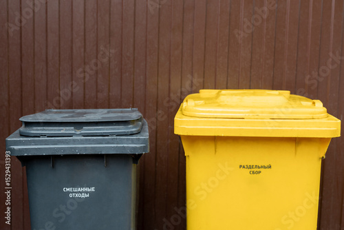 Waste sorting bins in the yard for environmental recycling, outdoor plastic, urban parks, symbols