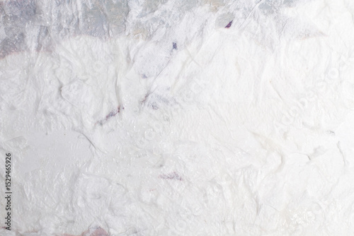 A white and gray textured background in a close up view