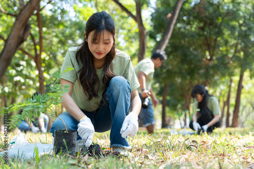 The volunteers show responsibility and teamwork as they collaborate to plant trees and care for plants. Their efforts support sustainability and conservation, helping earth thrive. Volunteer concept