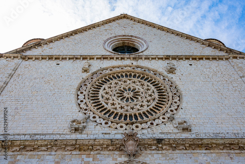 Tourists walk near the Basilica of Saint Francis in Assisi, Italy, a UNESCO World Heritage Site and a major pilgrimage destination