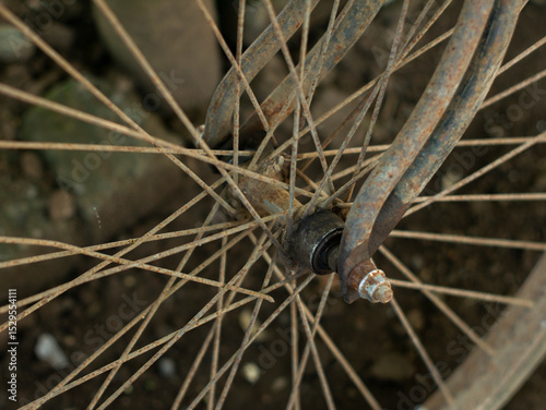 close up of an old bicycle wheel that has started to wear out.