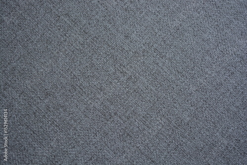 Things, objects, fabric backgrounds. Beautiful dense gray quality fabric with dark inclusions.