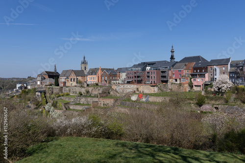 Panoramic view of the colorful Hanging Gardens of Thuin, in Hainaut Province in Belgium, captured in the springtime, on a sunny blue sky day. Copy space above.