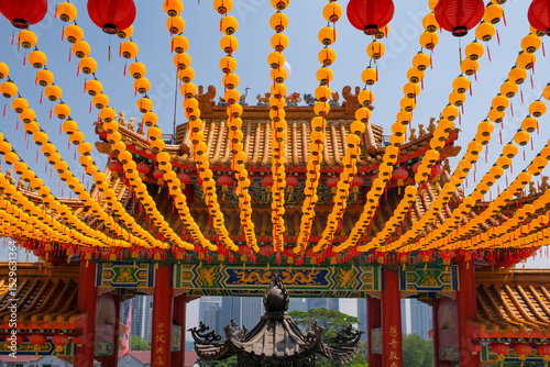 Canvas Print A stunning view of hundreds of yellow and red Chinese lanterns hanging in symmetrical rows above the entrance of Thean Hou Temple in Kuala Lumpur, Malaysia