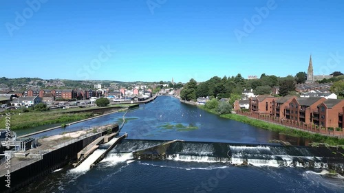 Exeter, Devon, England: DRONE VIEWS: Heading northwards over the River Exe and onwards to Exeter Quays and the city centre. Exeter is a popular UK travel destination (Clip 2 of 3).