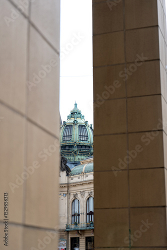 Photography Baroque dome seen between modern walls