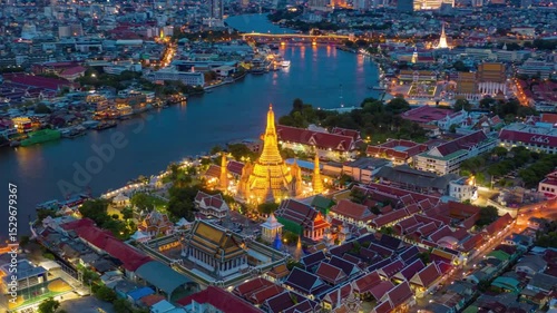 Aerial View of Wat Arun Ratchawararam Ratchawaramahawihan at Dusk, Bangkok River