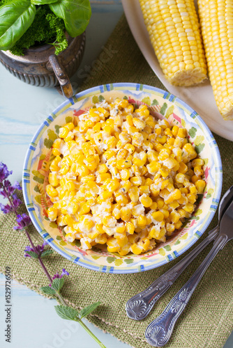 Honey butter skillet corn in bowl. View from above, top studio shot