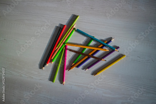 colored pencils are lying on the floor