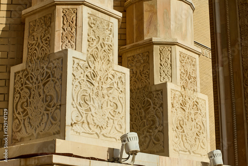 The stone carving showcases intricate Eastern patterns, highlighting the architectural mastery and detailed façade