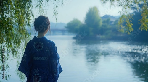 Woman in traditional clothing by a serene river