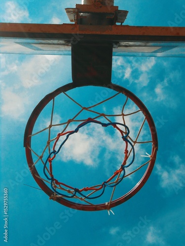 basketball hoop against blue sky