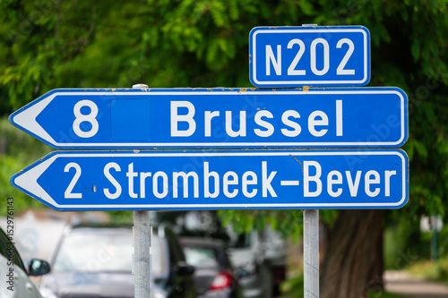 National road N 202 with direction signs to Brussels and Strombeek Bever in Vilvoorde, Flemish Brabant, Belgium