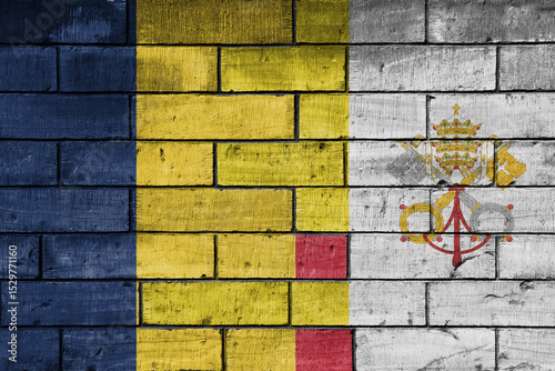 colourful painted big national flag of vatican city and flag of romania on a massive old brick wall background. concept