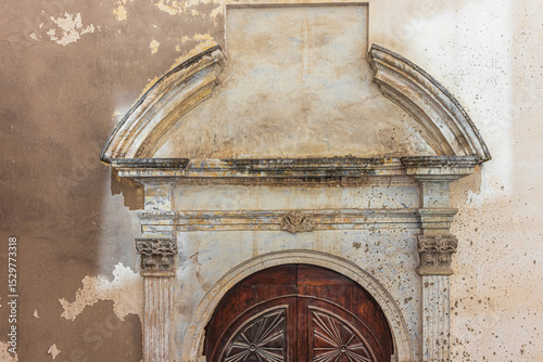Architrave of the side entrance in the Church of the Holy Sepulchre. Cagliari, Sardinia, Italy