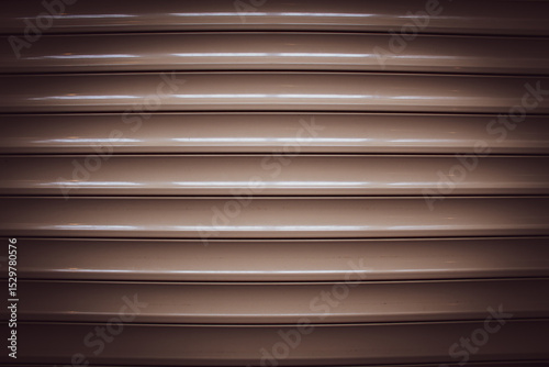 long glossy brown panels on the wall, parallel lines