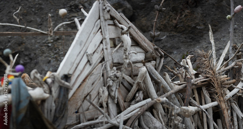 Driftwood arranged on a rocky beach in San Francisco, California.