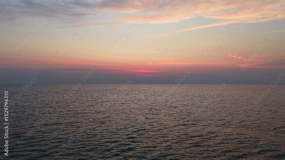 Yacht and fishing boat sailing The calm sea at sunset Yacht and fishing boat sailing The calm sea at sunset