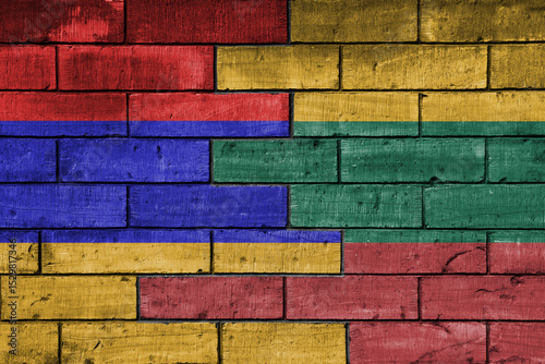 colourful painted big national flag of lithuania and flag of armenia on a massive old brick wall background. concept