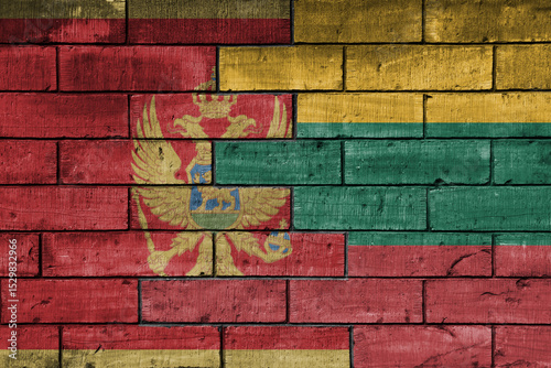 colourful painted big national flag of lithuania and flag of montenegro on a massive old brick wall background. concept