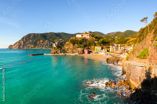 Fototapeta Naklejka Na Ścianę i Meble -  Picturesque Monterosso al Mare in Cinque Terre, Liguria, Italy bathed in bright summer sun. Ligurian sea in summer time. Landscape photography