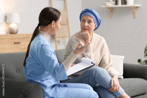 Konstfotografi Woman with cancer and nurse at home