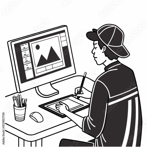 Young graphic designer working on computer tablet