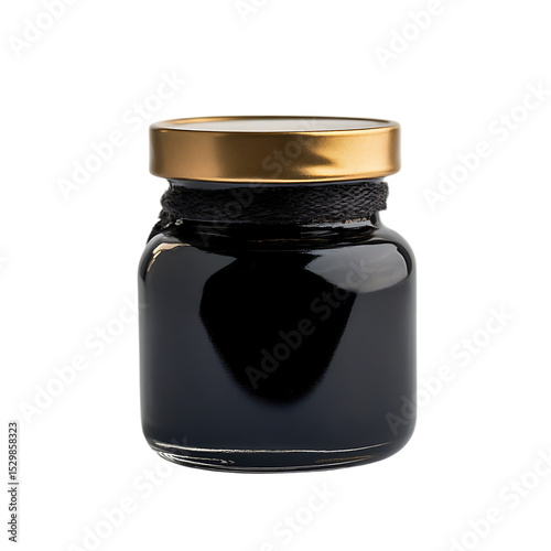 Small jar of black food product with gold lid.