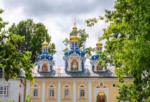 Colorful domes of the Pechora Holy Dormition Pskovo-Pechersky Monastery. Pskov region religion, Christianity history photo