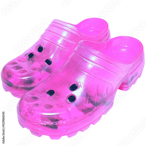 A pair of pink translucent clogs with ventilation holes and textured soles designed for casual and comfortable wear.