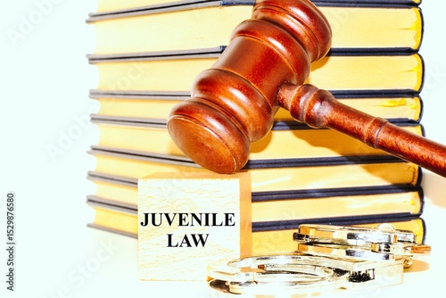 Judge's gavel , books, handcuffs and the word 