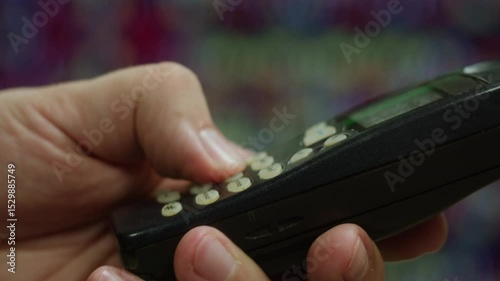 80s 90s retro vintage cell phone being used by a young adult woman, taking old mobile phone with antenna from jeans pocket.