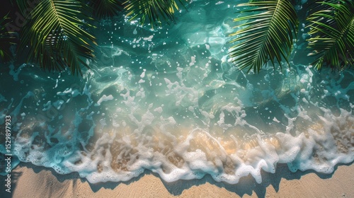 An aerial view captures the clear blue ocean waves gently lapping at the shore, framed by lush palm leaves, evoking feelings of relaxation and tropical bliss.