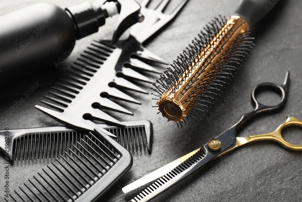 Different barber's tools on black table, closeup Different barber's tools on black table, closeup