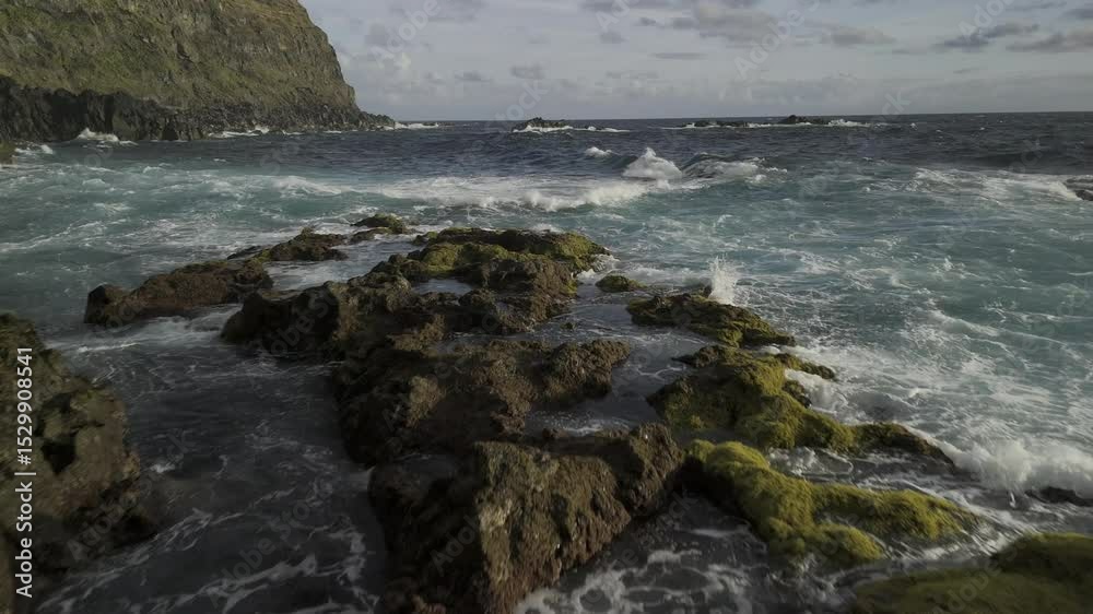 Drone flies low over tide pools at Ponta da Ferraria and out to sea in Sete Cidades region, Sao Miguel, Azores, Portugal