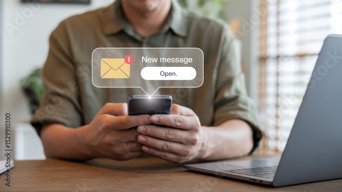 Notification of a new message on smartphone in casual work environment, emphasizing communication and alerts in a digital workspace.