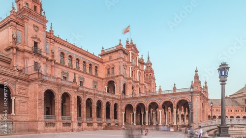 Plaza de Espana in Seville timelapse hyperlapse, a grand architectural complex in Maria Luisa Park built for the Ibero-American Exposition. Bridges and vintage streetlights during sunset