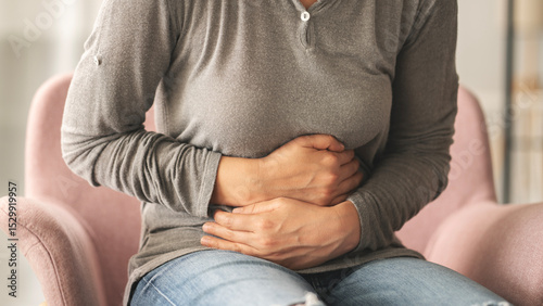 Tableau sur toile Young woman with stomach ache