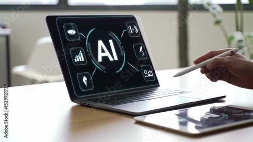 Laptop displays ai with icons Hand holding a stylus Tablet nearby