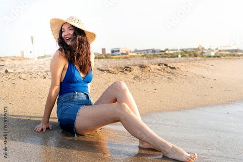 Wallpaper Mural Young woman relaxing on the beach, enjoying summer vacation Torontodigital.ca