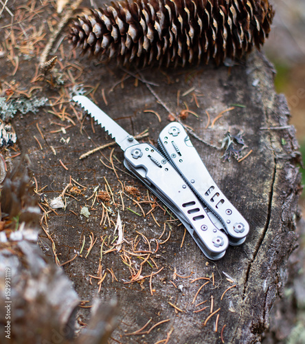 multitool in the forest, on a stump