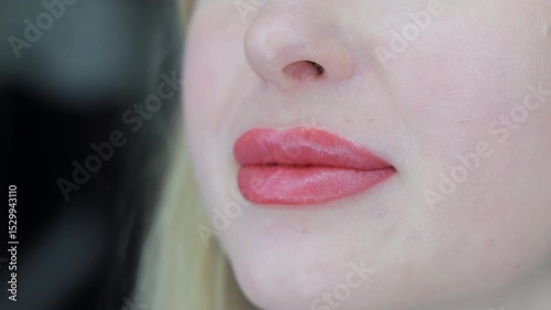 Healed lips after permanent makeup, close-up of well-defined shape and natural pink tone, Smooth and symmetrical result showcasing aesthetic precision