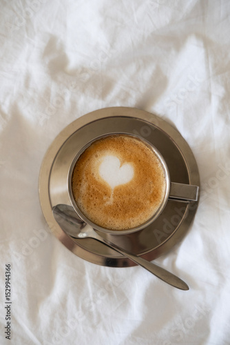 Stainless Steel Vintage Coffee Cup with Latte on White Sheet 