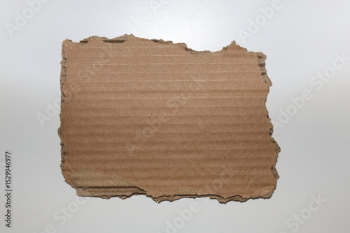 Small cartboard pieces of cardboard with torn edges