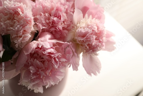 Fototapeta Naklejka Na Ścianę i Meble -  Bouquet of beautiful peonies in vase indoors, closeup