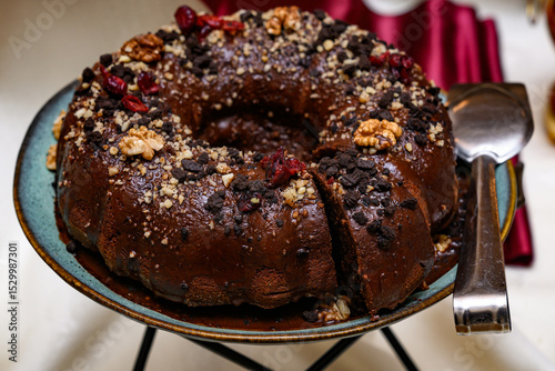 A Gugelhupf (Kuglof) is a cake traditionally baked in a distinctive ring pan, similar to Bundt cake, but leavened with baker's yeast. 