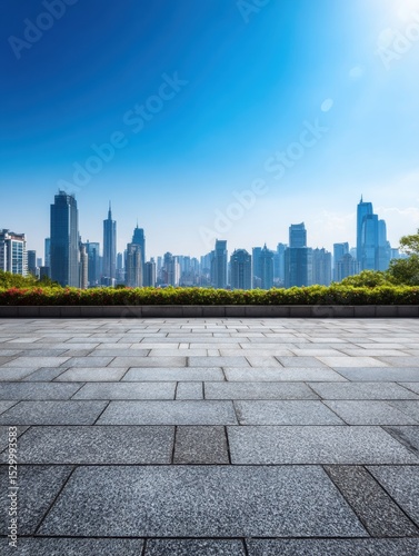 Empty paved plaza in front of modern city buildings.